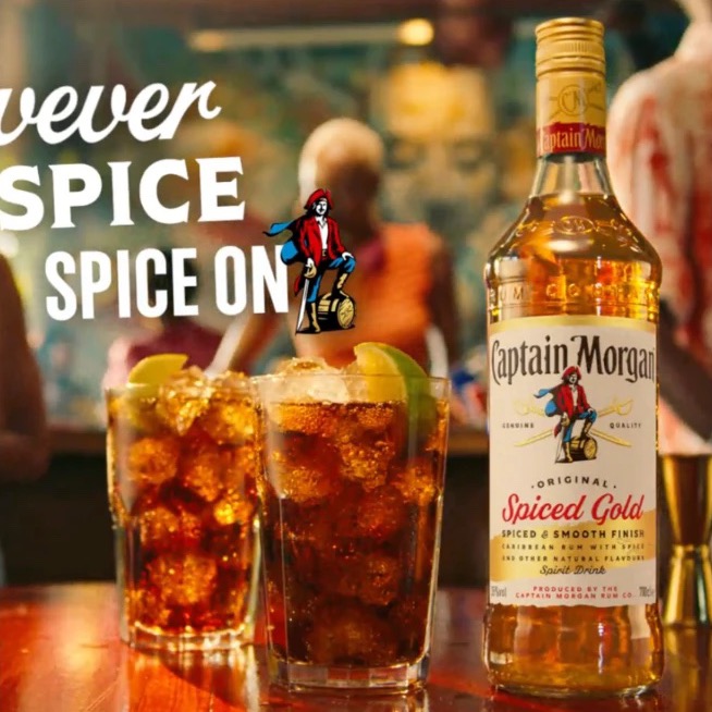Captain Morgan Spiced Gold campaign image with two rum and colas